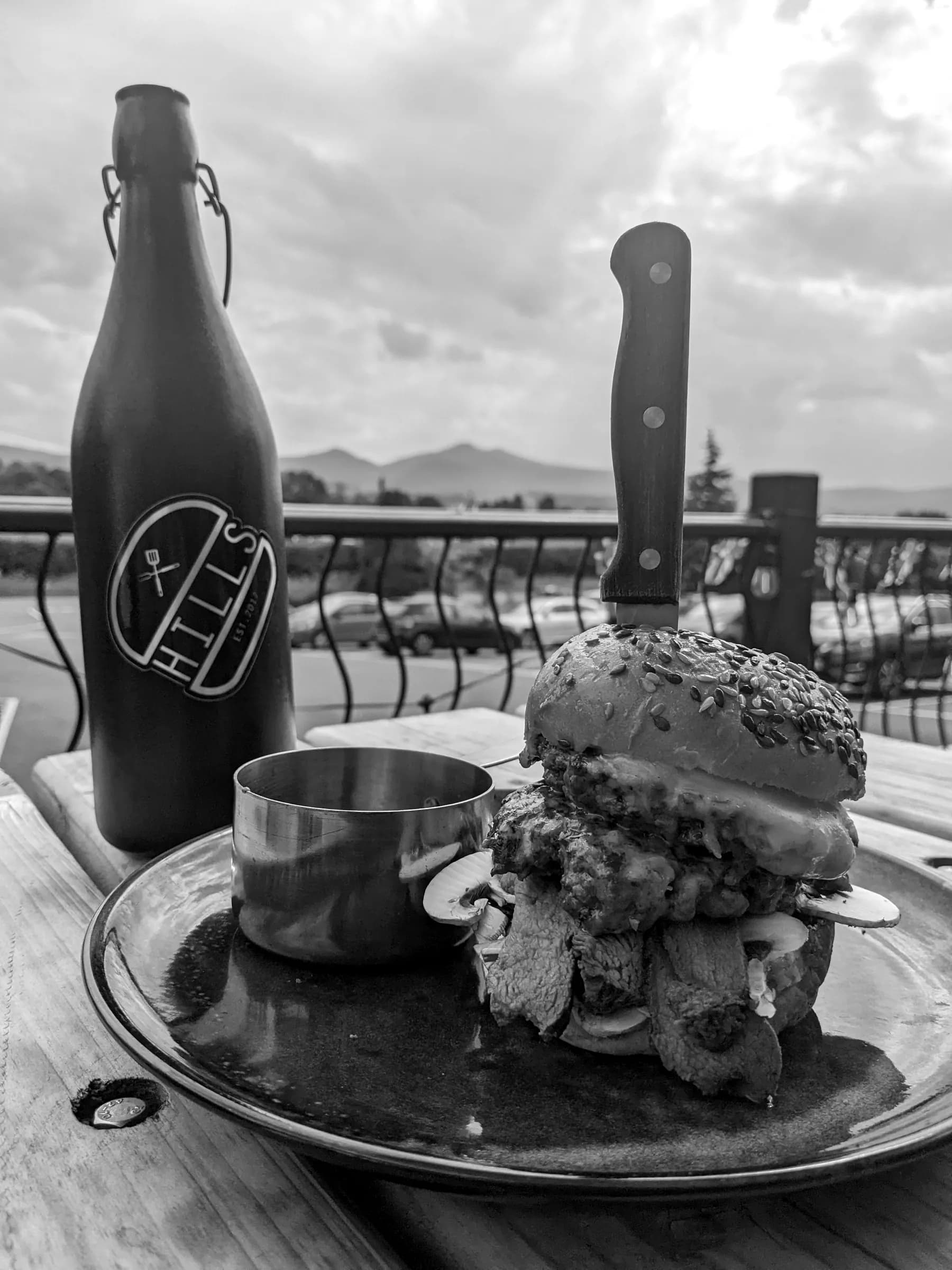 A burger at Hills, with the hills behind