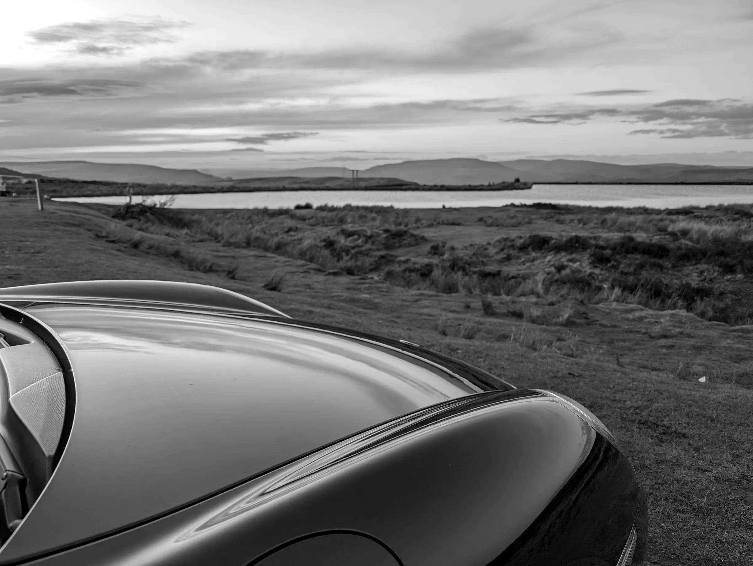 Sunset over Keeper's Pond, seen over a black bonnet