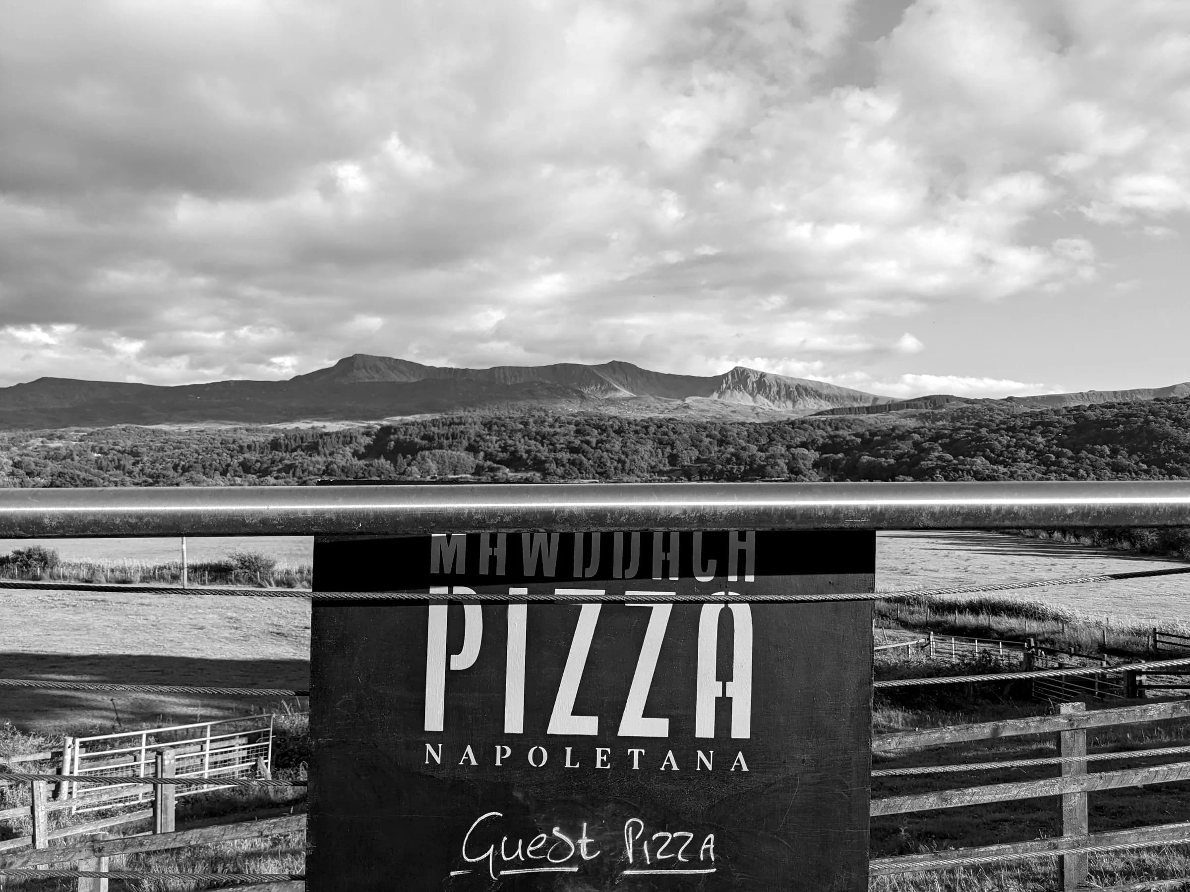 The Mawddach Pizza Napoletana sign with the hills behind